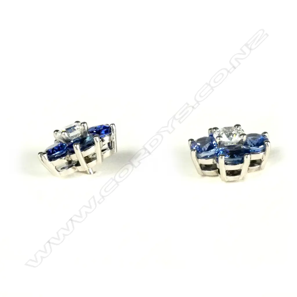 A pair of 18ct white gold sapphire and diamond earrings Image 1++