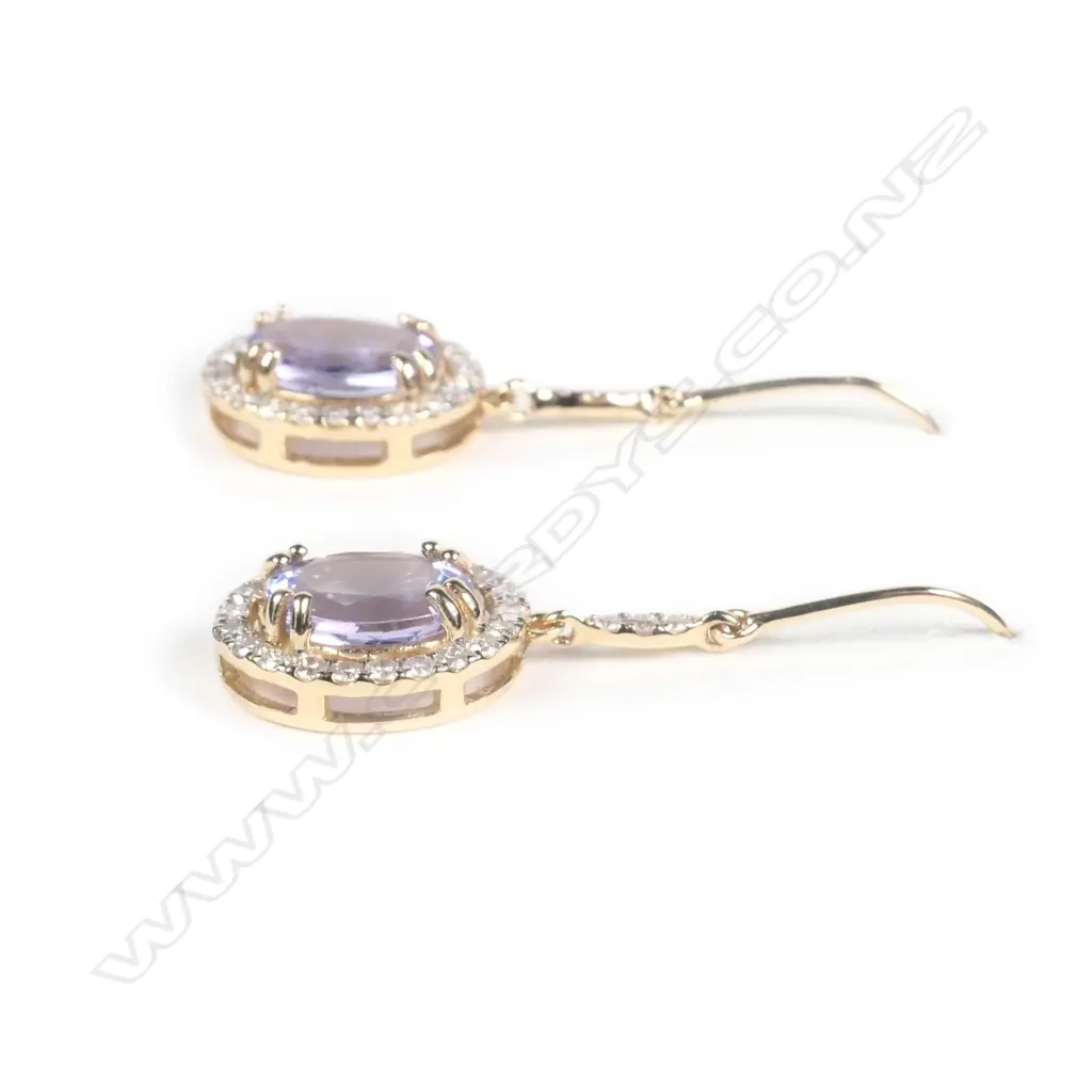 A pair of 14ct yellow gold tanzanite and diamond drop earrings Image 1++