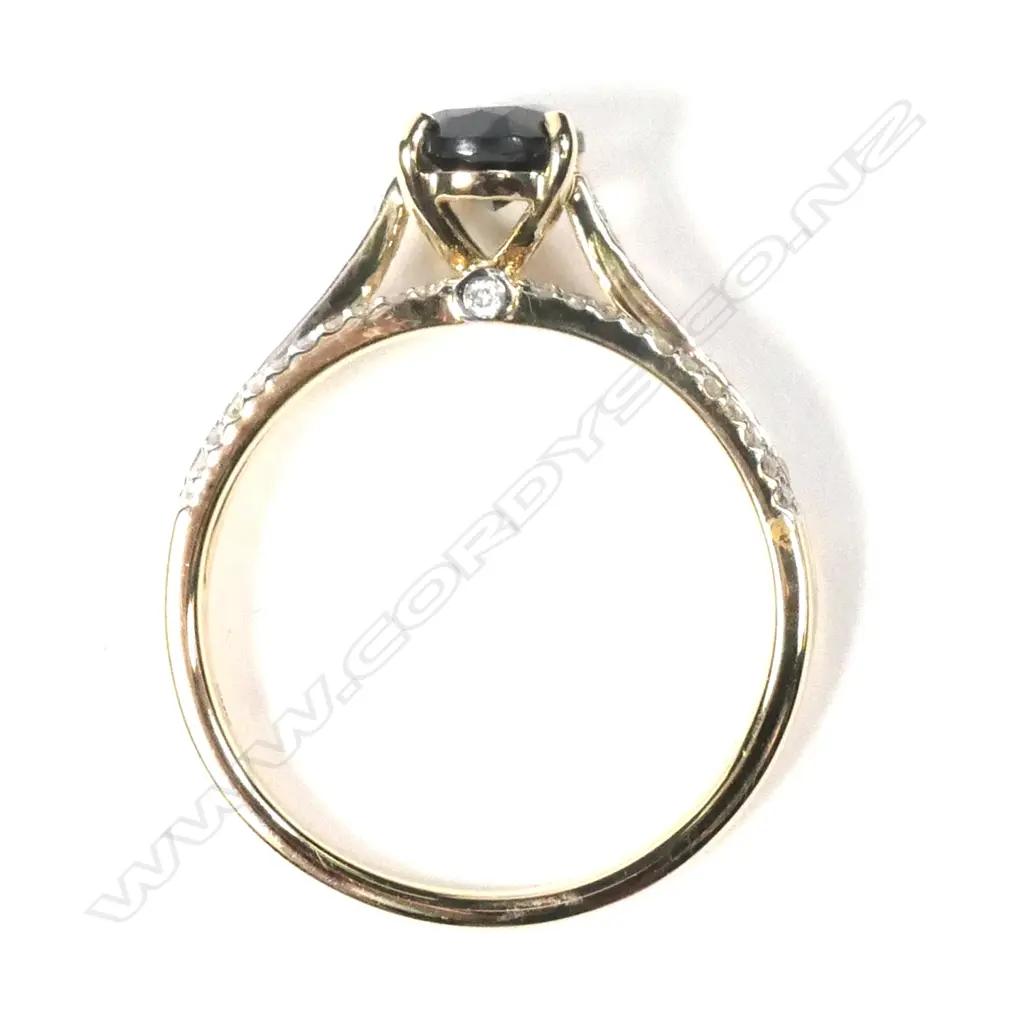 A 14ct yellow gold sapphire and diamond ring Image 1++
