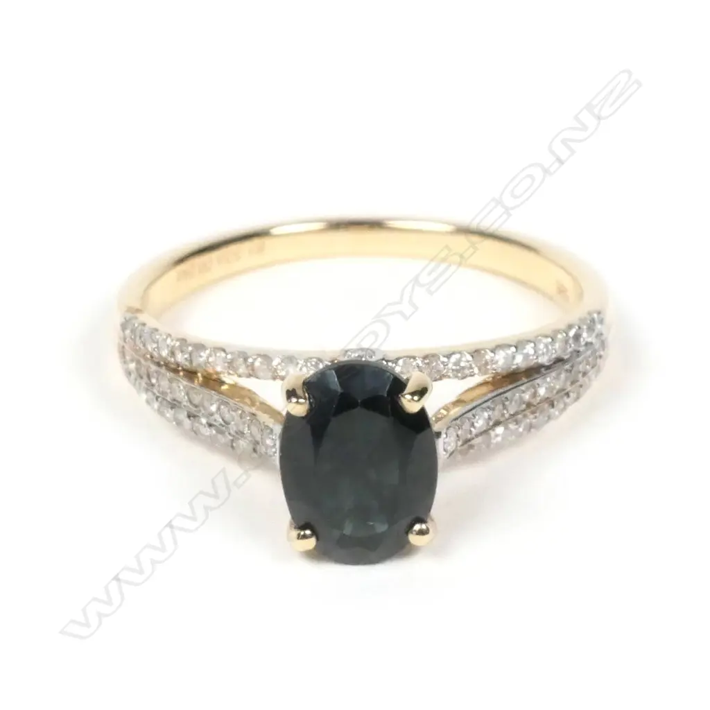 A 14ct yellow gold sapphire and diamond ring Image 1++