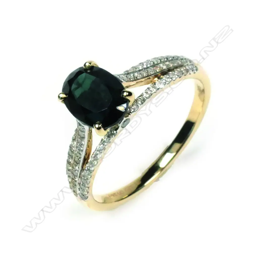 A 14ct yellow gold sapphire and diamond ring Image 1++