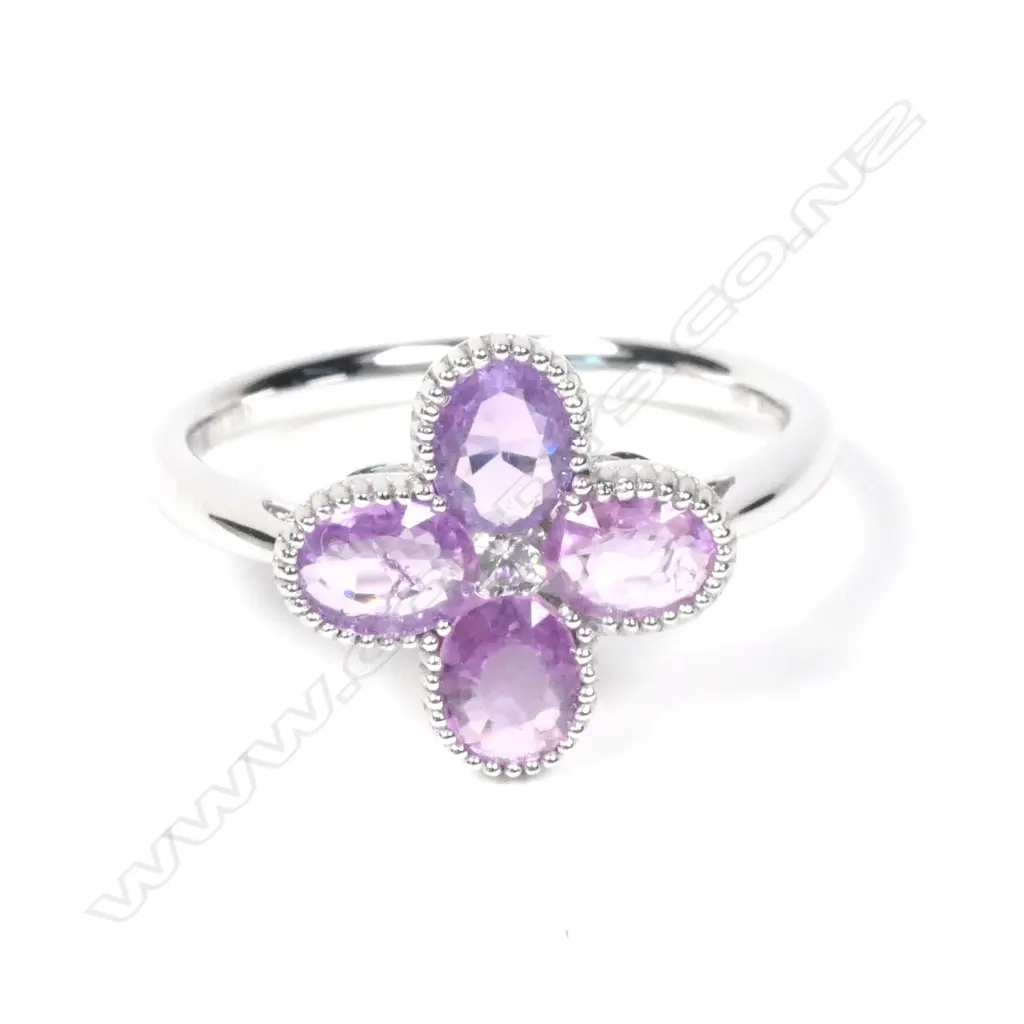 A 14ct white gold Ceylonese sapphire and diamond ring Image 1++