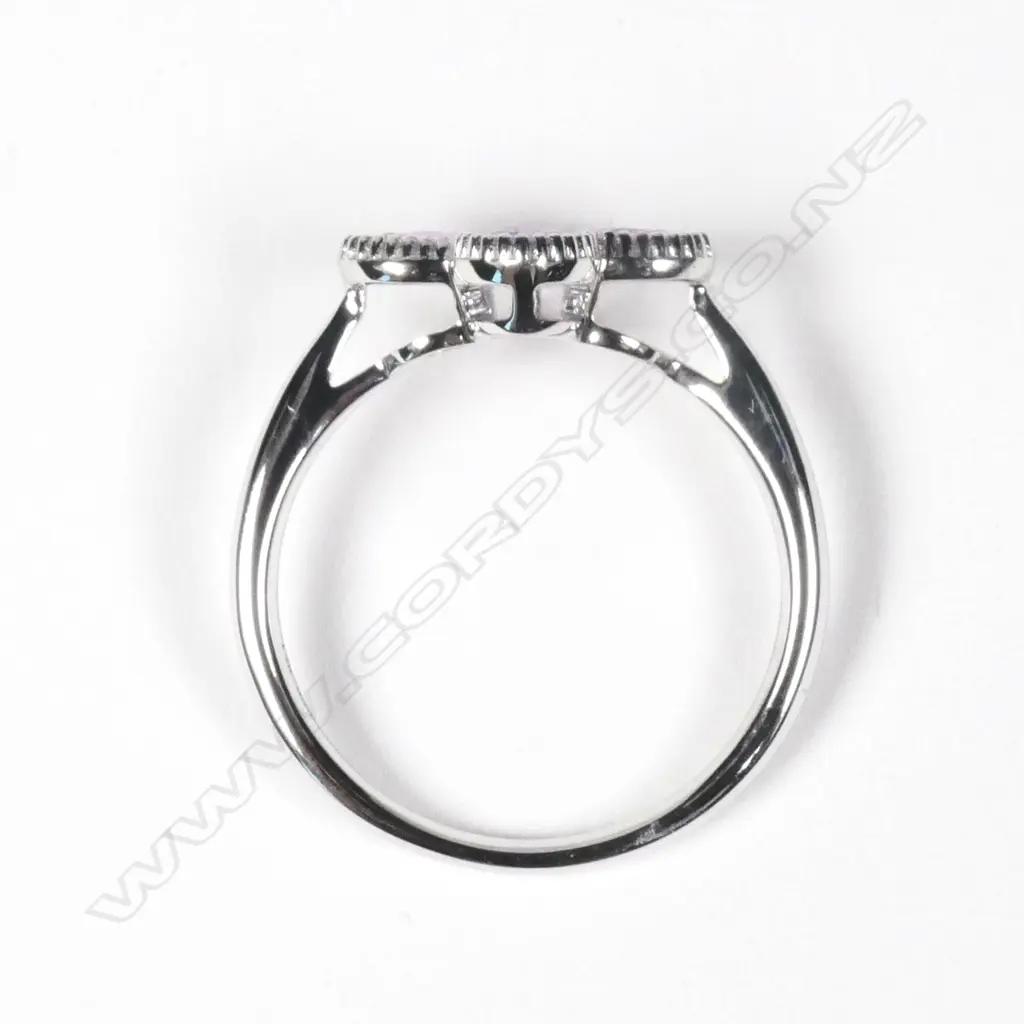 A 14ct white gold Ceylonese sapphire and diamond ring Image 1++