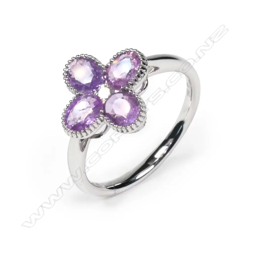 A 14ct white gold Ceylonese sapphire and diamond ring Image 1++