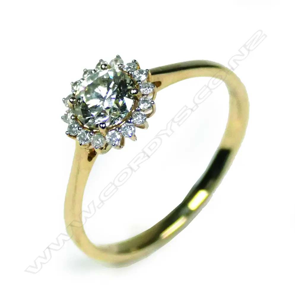 A 14ct yellow gold diamond halo ring Image 1++