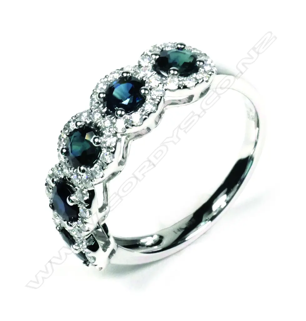 A 14ct white gold sapphire and diamond ring Image 1++