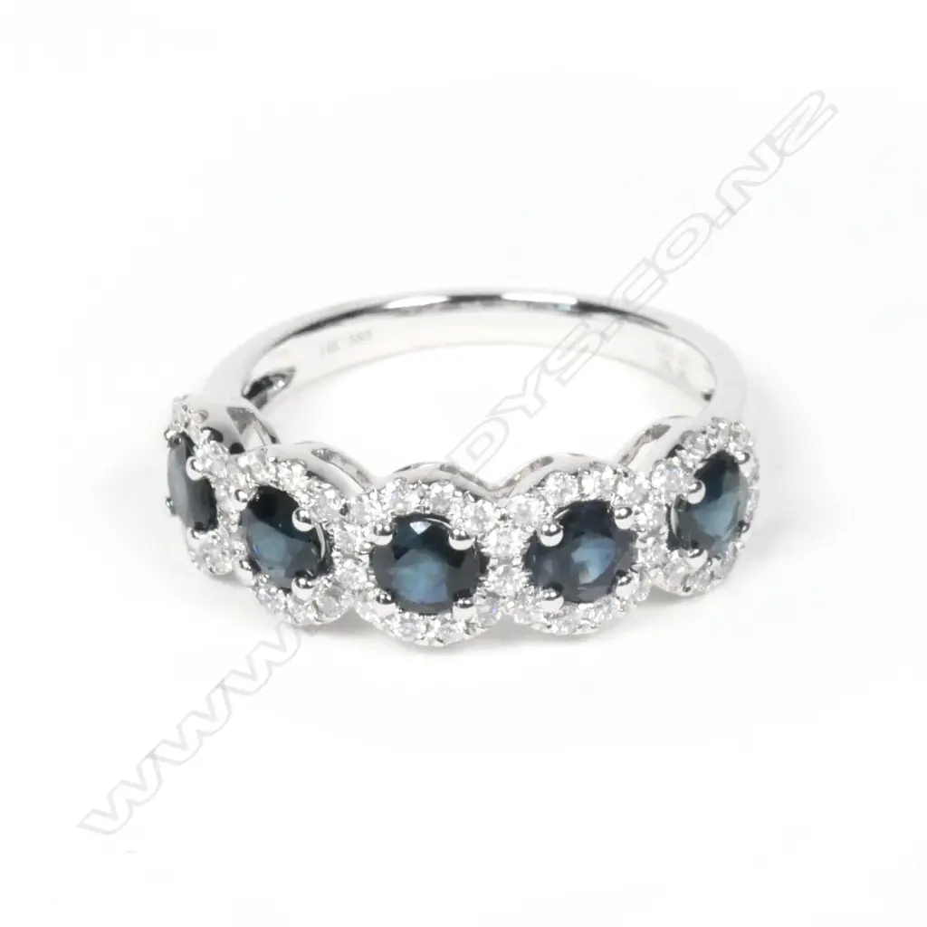 A 14ct white gold sapphire and diamond ring Image 1++
