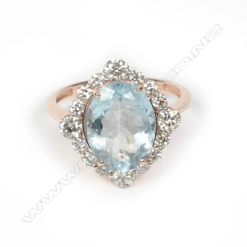 A 14ct rose gold aquamarine and diamond ring Image 1++