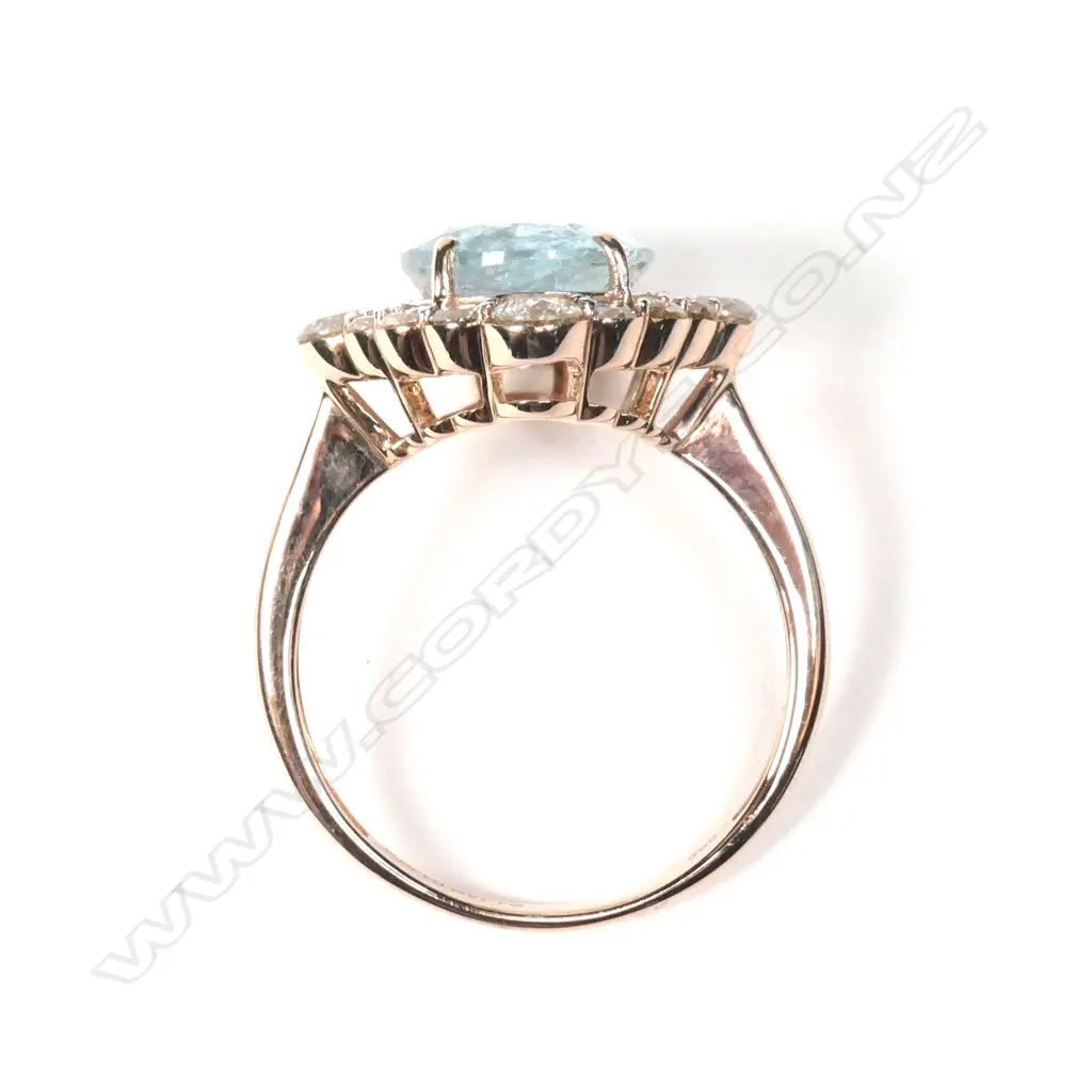 A 14ct rose gold aquamarine and diamond ring Image 1++