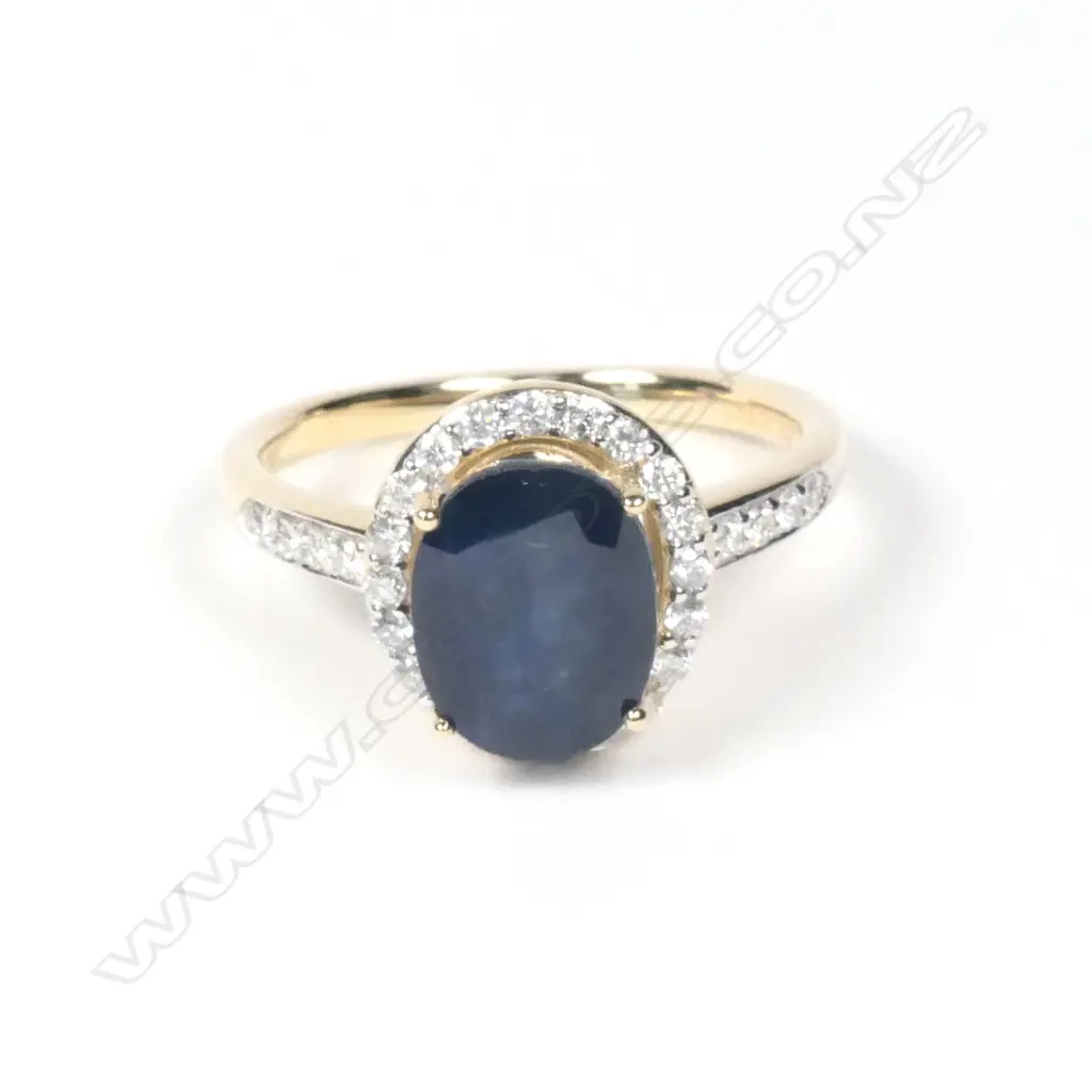 A 14ct yellow gold sapphire and diamond halo ring Image 1++