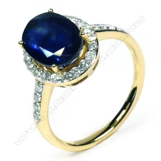A 14ct yellow gold sapphire and diamond halo ring