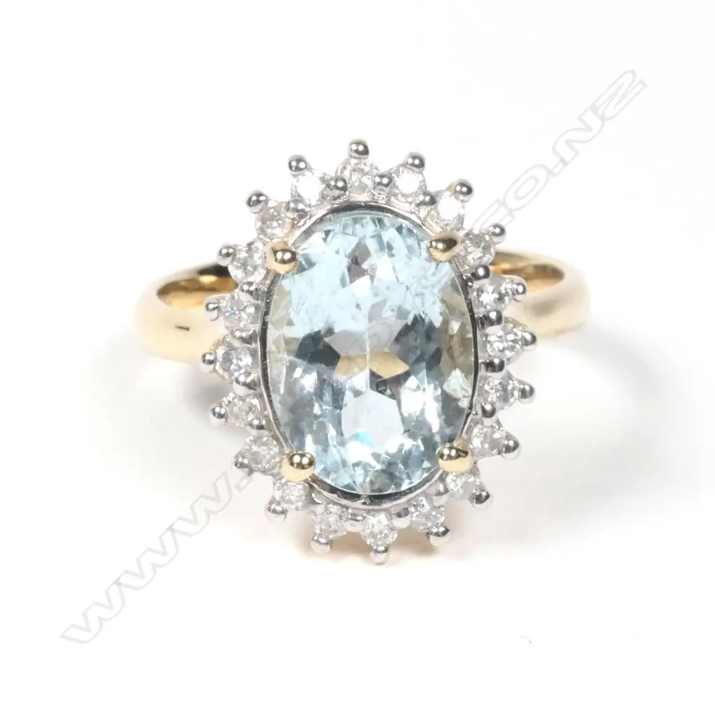 A 14ct yellow gold aquamarine and diamond ring Image 1++