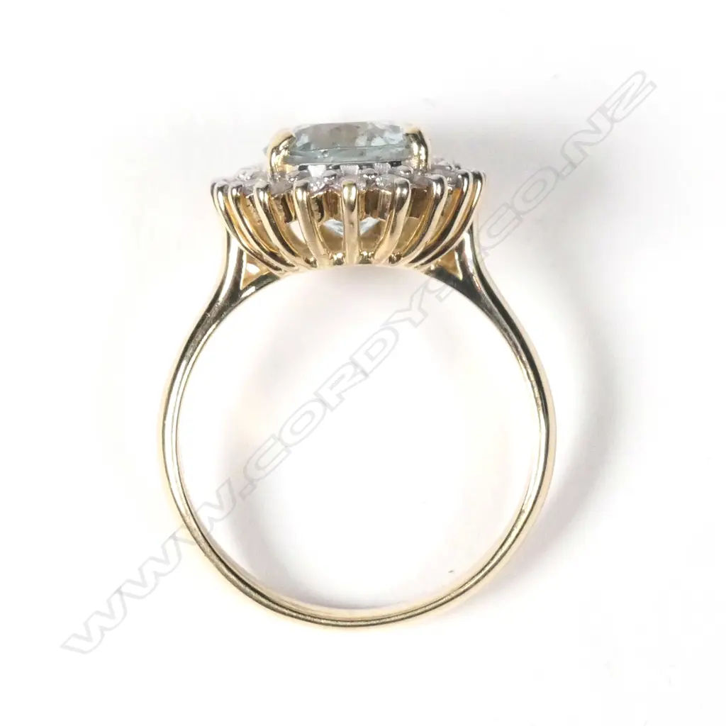 A 14ct yellow gold aquamarine and diamond ring Image 1++