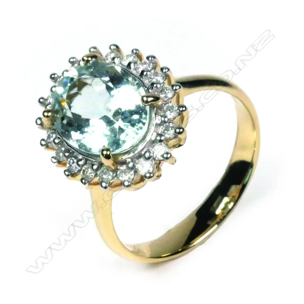 A 14ct yellow gold aquamarine and diamond ring Image 1++