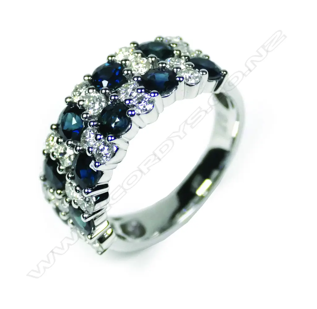 A 14ct white gold sapphire and diamond ring Image 1++
