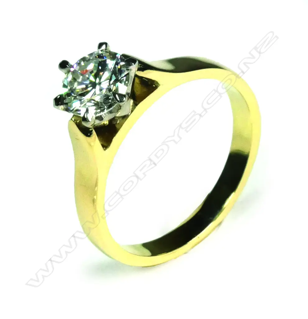 An estate 18ct gold and diamond solitaire ring Image 1++