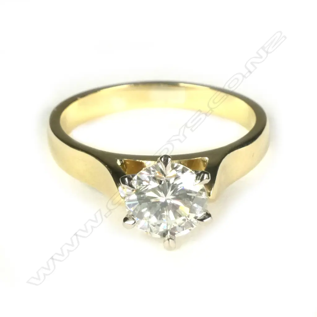 An estate 18ct gold and diamond solitaire ring Image 1++