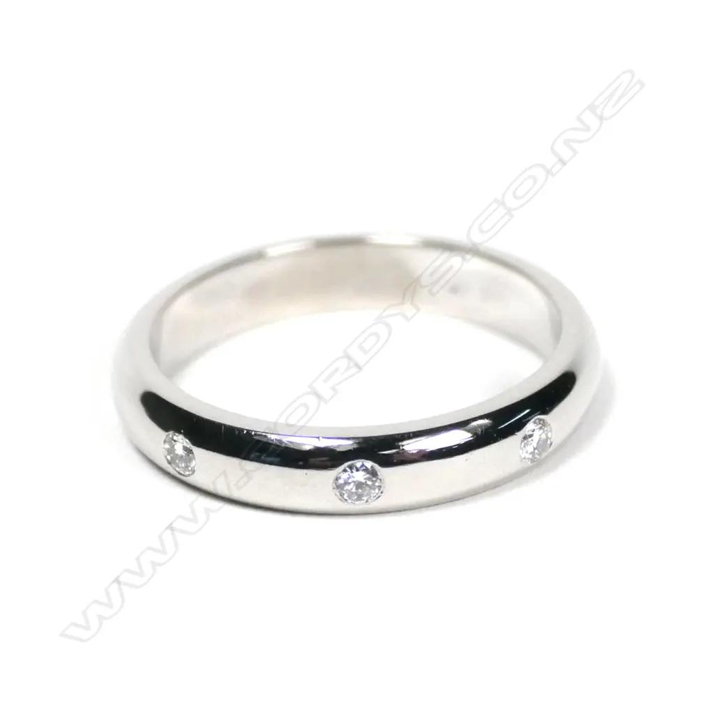A modern 18ct white gold and three diamond gypsy type ring Image 1++