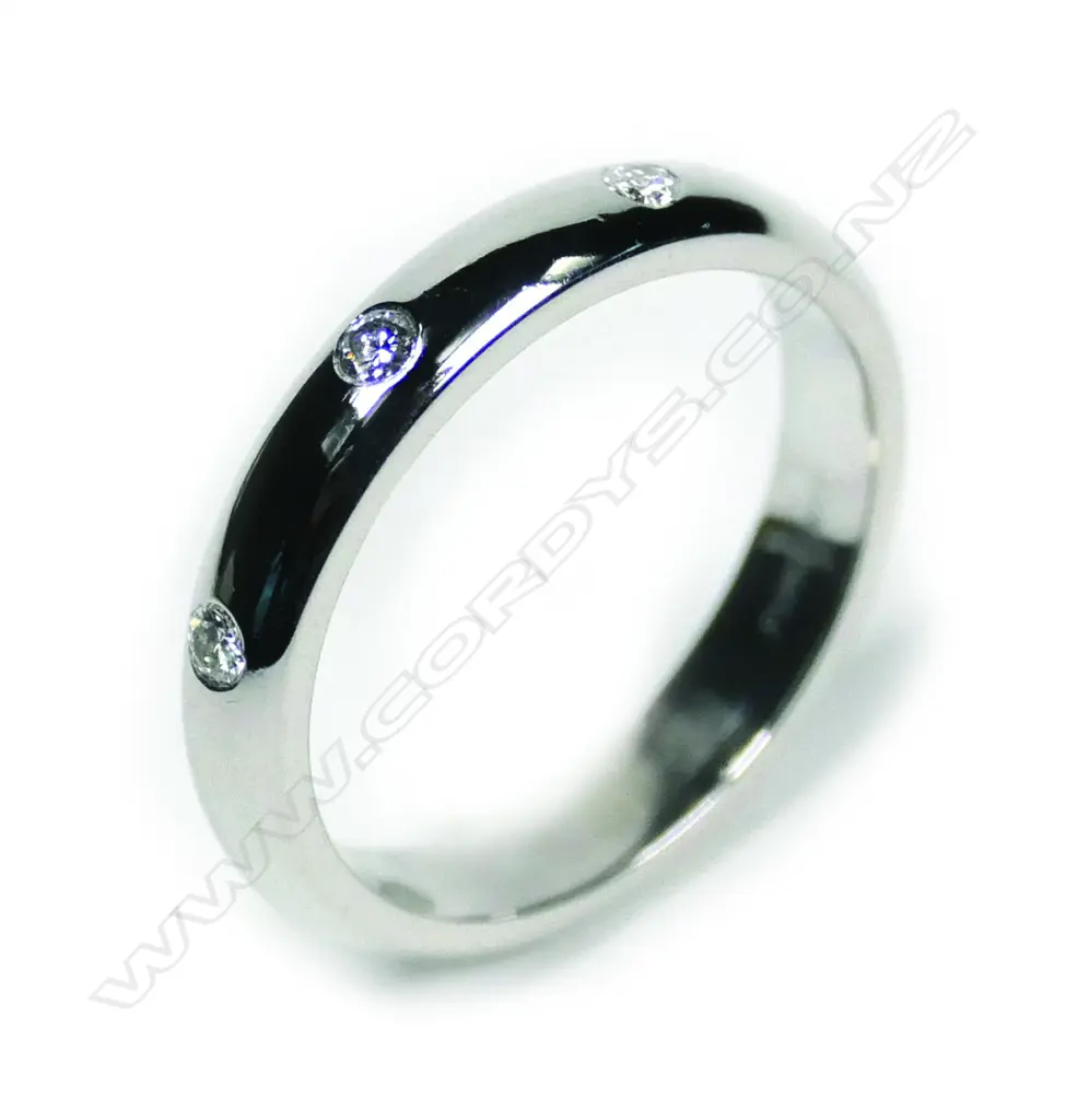 A modern 18ct white gold and three diamond gypsy type ring Image 1++