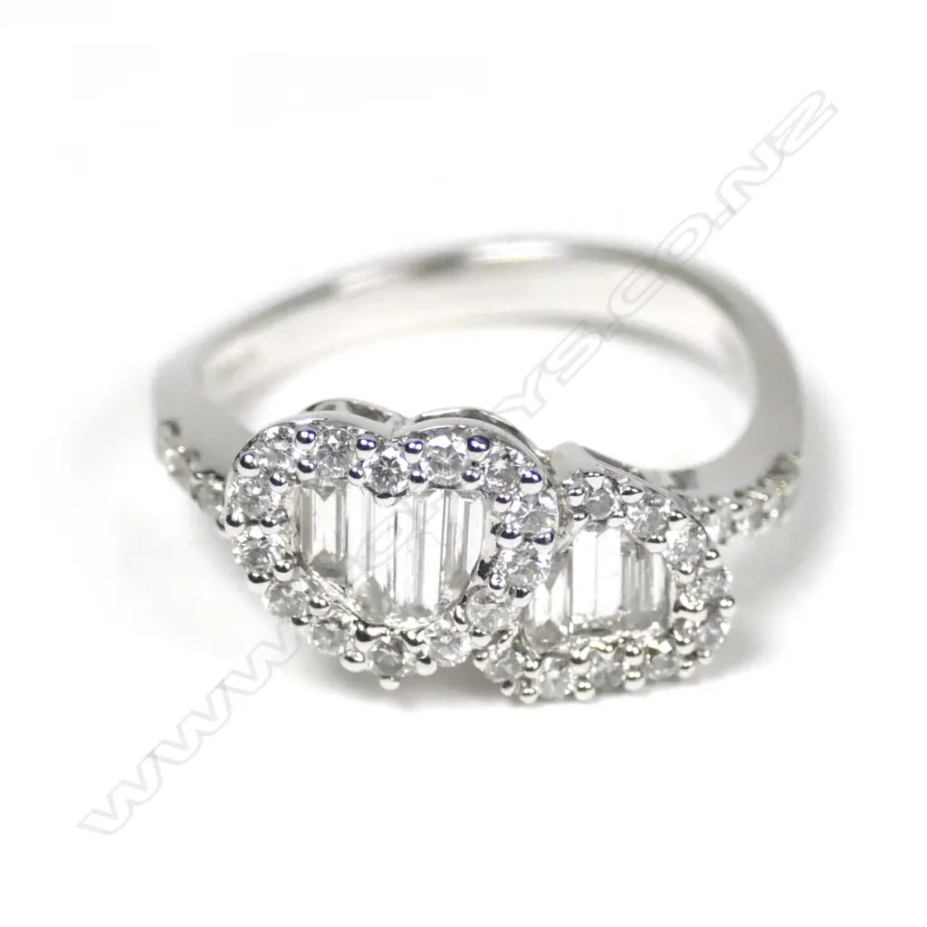 A modern 18ct white gold and diamond twin heart ring Image 1++