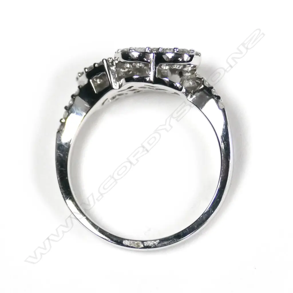 A modern 18ct white gold and diamond twin heart ring Image 1++