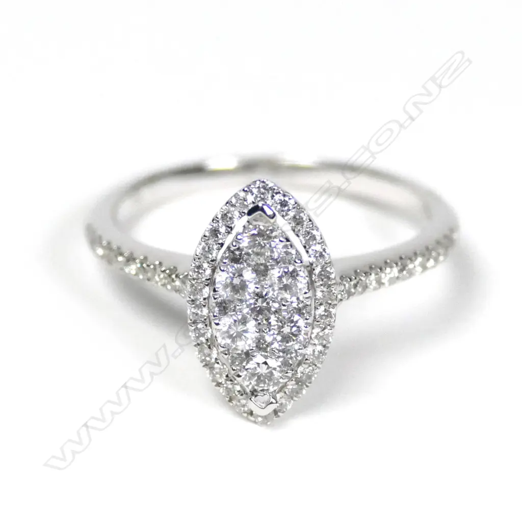 An 18ct white gold and diamond oval cluster ring Image 1++