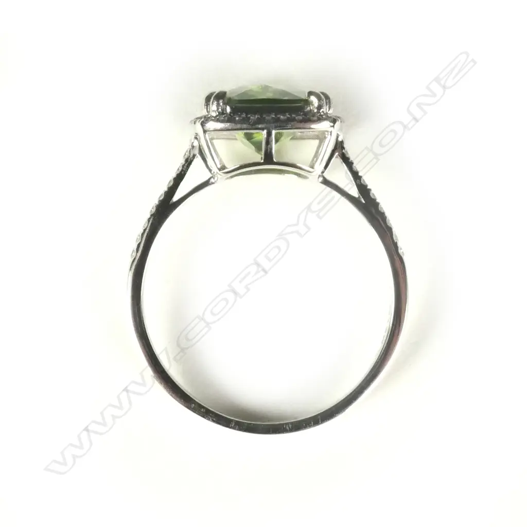 A 14ct white gold peridot and diamond ring Image 1++