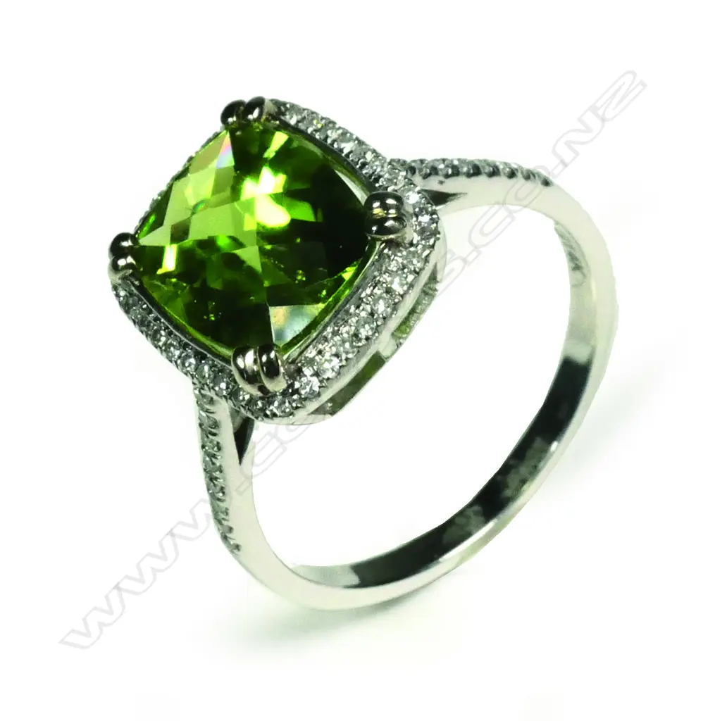 A 14ct white gold peridot and diamond ring Image 1++