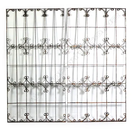 A pair of vintage wrought iron window grills