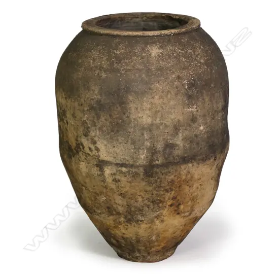 An old European terracotta tall olive oil storage jar