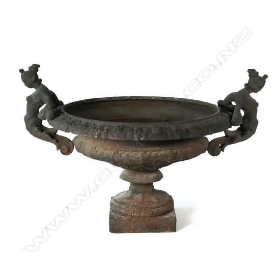 A cast iron garden urn