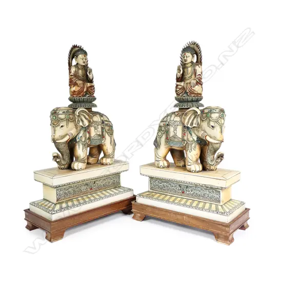 A pair of vintage ivory figures