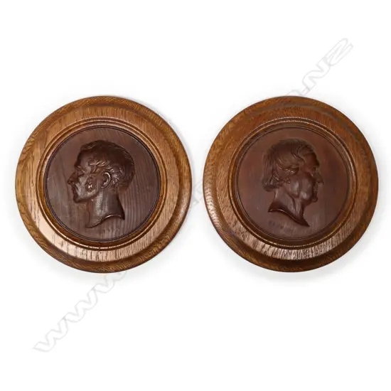 Two relief timber plaques of the composers Rossini and Auber
