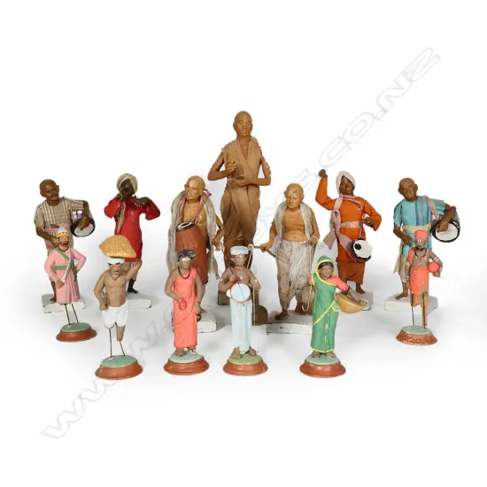 Fourteen clay figures of musicians and other characters