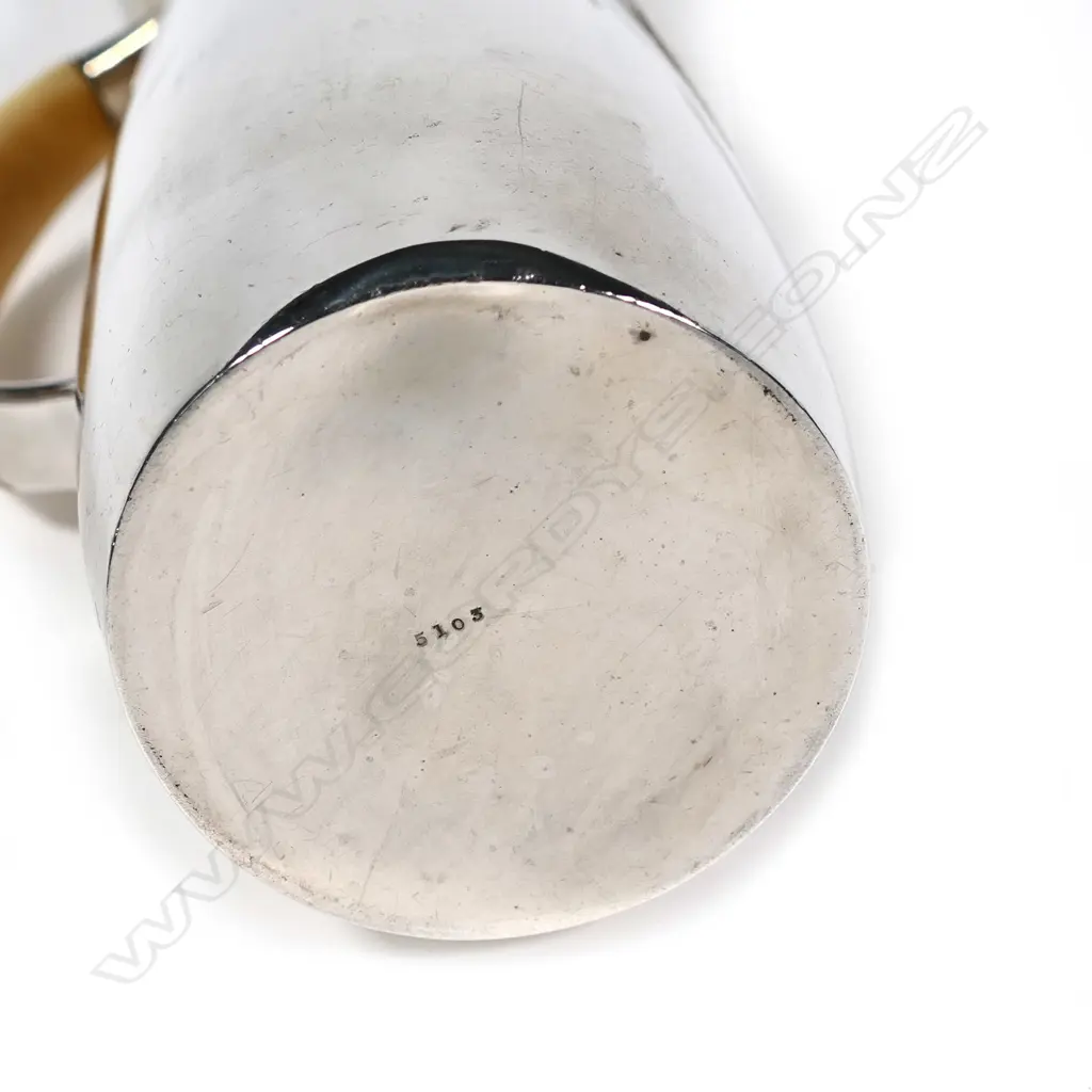 A rare Archibald Knox three-piece Cymric silver coffee service for Liberty & Co. Image 1++