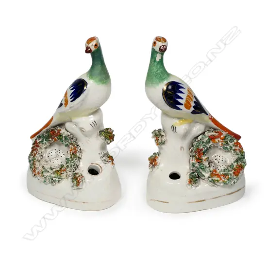 A pair of uncommon Victorian Staffordshire bird pen stands