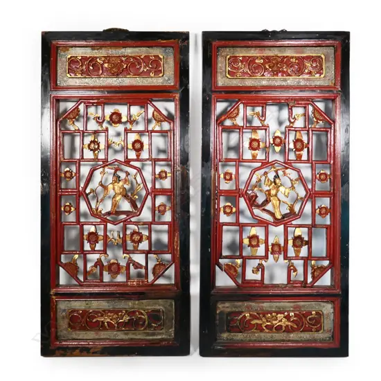 A pair of Chinese gilded and lacquered panels
