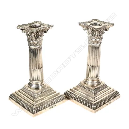 A pair of early 1900s silver candlesticks