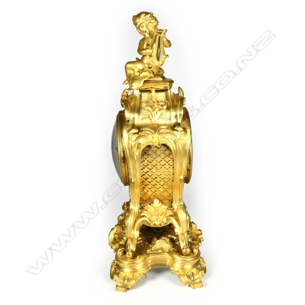 A 19thC French Rococo ormolu mantel clock Image 1++