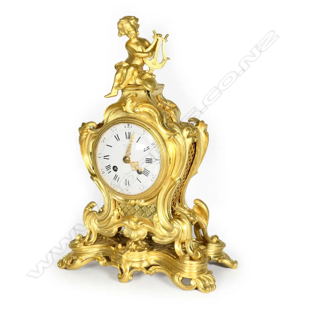 A 19thC French Rococo ormolu mantel clock Image 1++