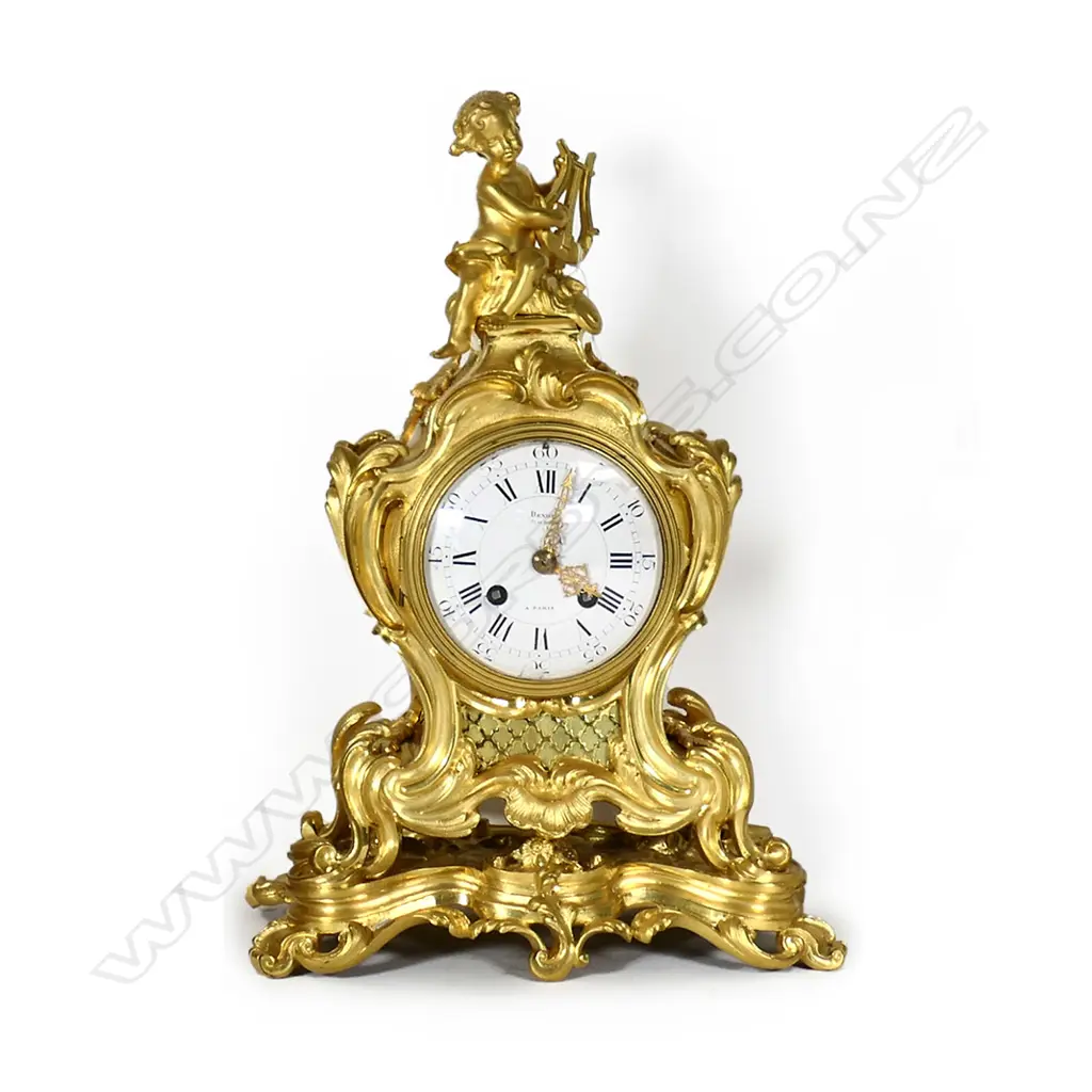 A 19thC French Rococo ormolu mantel clock Image 1++