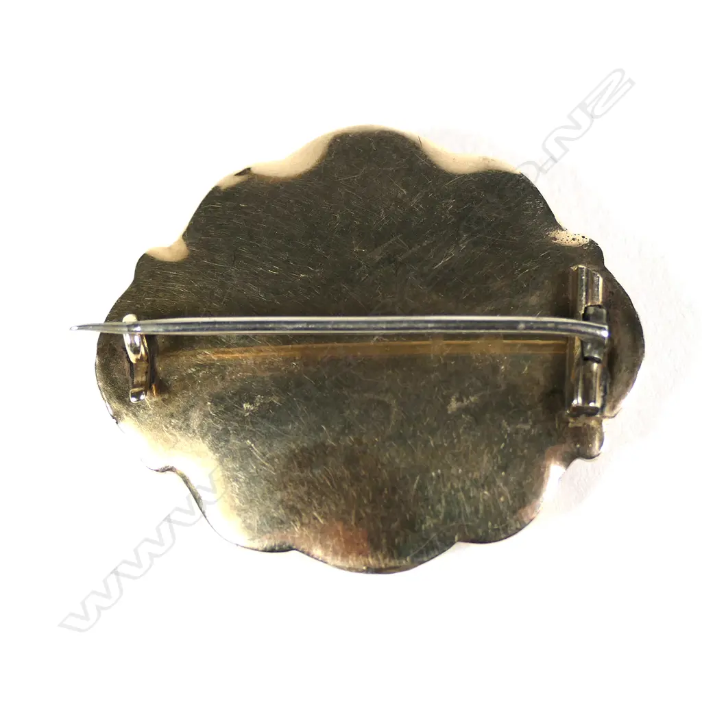 A 19thC 9ct gold memorial brooch, black enamel and seed pearl band framing the plaited hair panel. Image 1++