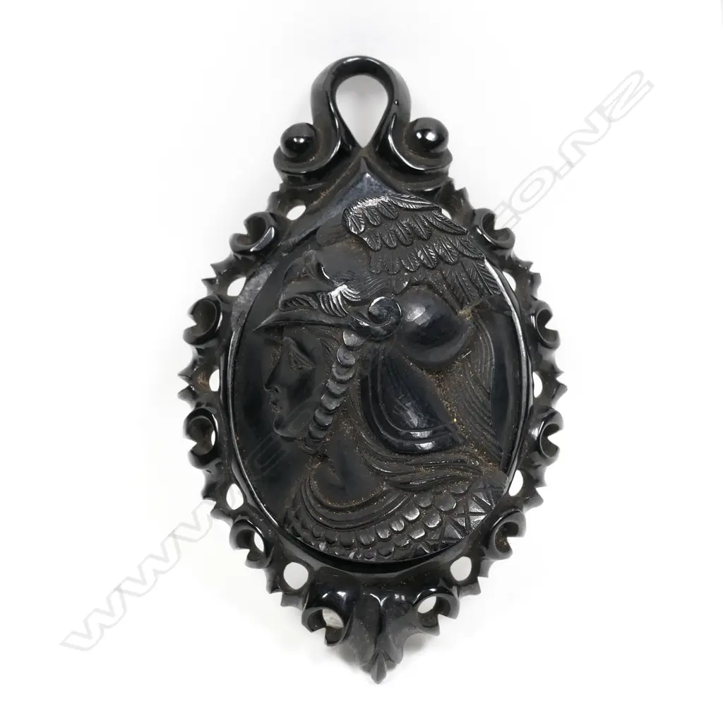 A late 19thC vulcanite carved portrait brooch, high relief in profile, the figure wearing a winged helmet. L.87mm. Minor fault. Image 1++