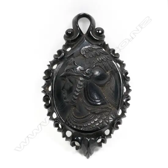 A late 19thC vulcanite carved portrait brooch, high relief in profile, the figure wearing a winged helmet. L.87mm. Minor fault.