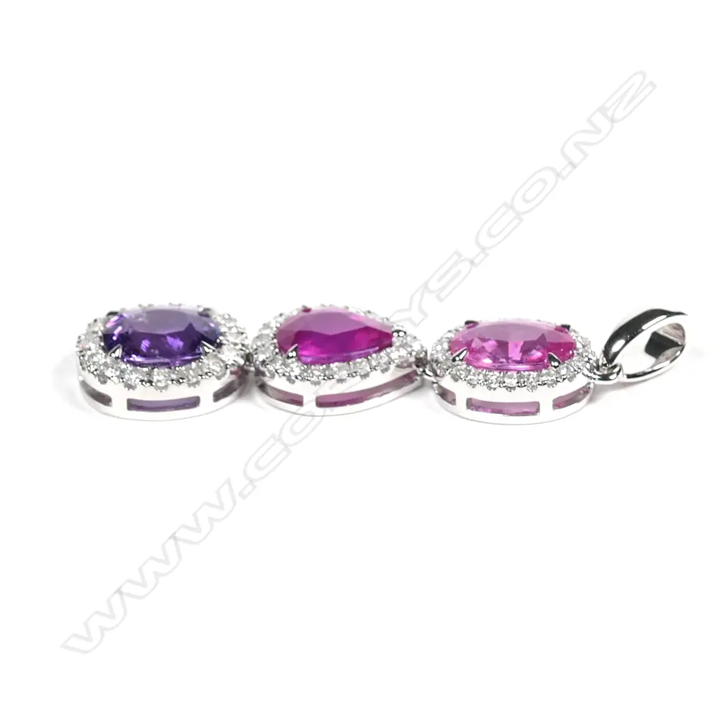 A 14ct white gold pink sapphire and diamond drop pendant Image 1++