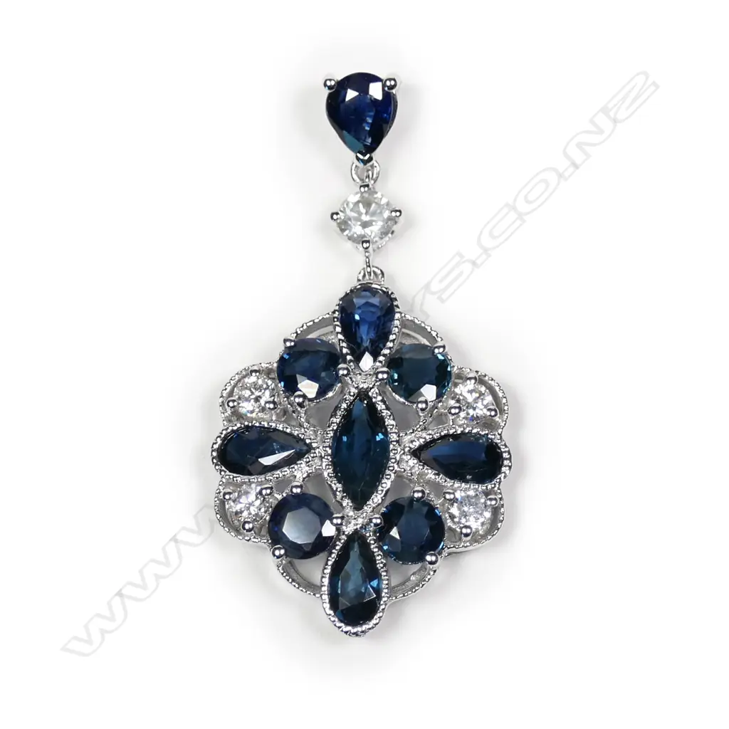 A 14ct white gold sapphire and diamond pendant Image 1++