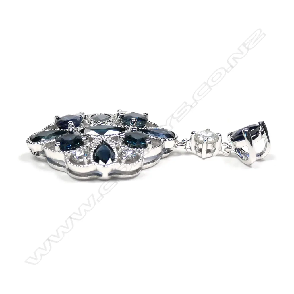 A 14ct white gold sapphire and diamond pendant Image 1++