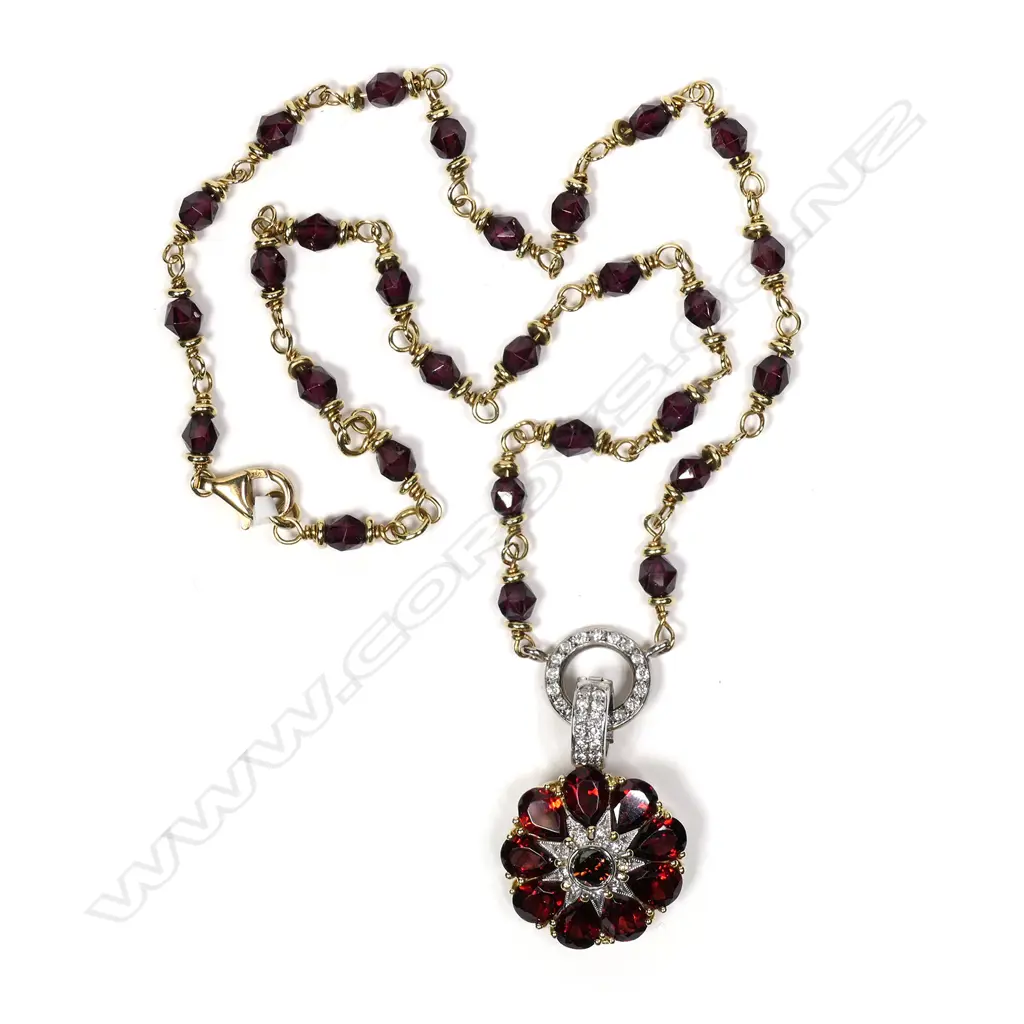An 18ct yellow gold garnet and diamond handmade necklace Image 1++