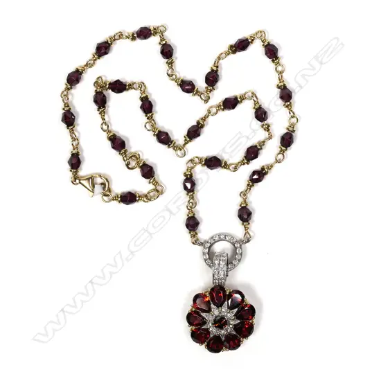 An 18ct yellow gold garnet and diamond handmade necklace
