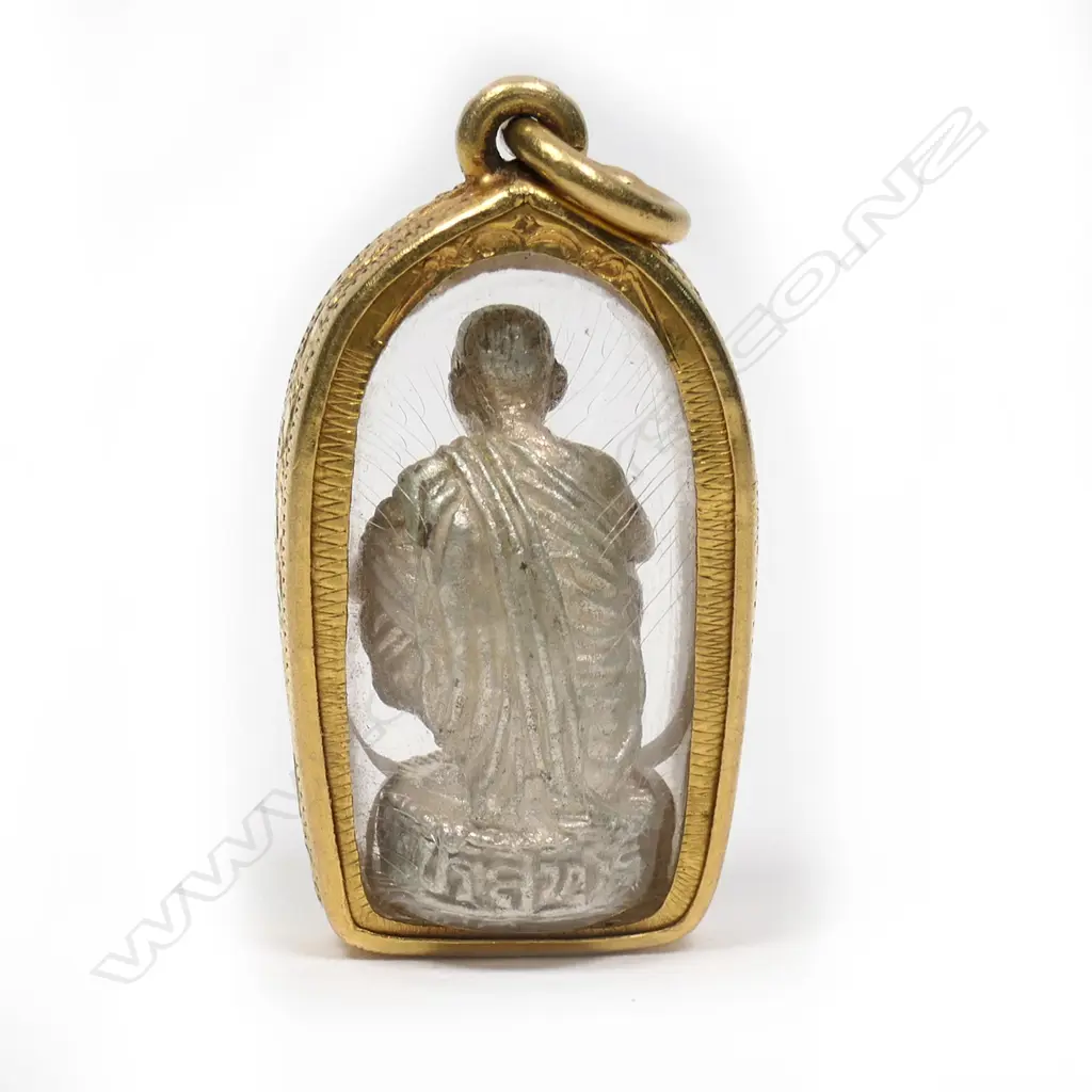 A 22ct gold framed encased buddha pendant Image 1++
